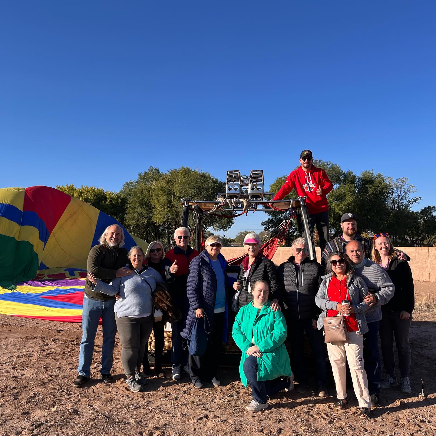Colourful hot air balloon canopy inflating at sunrise