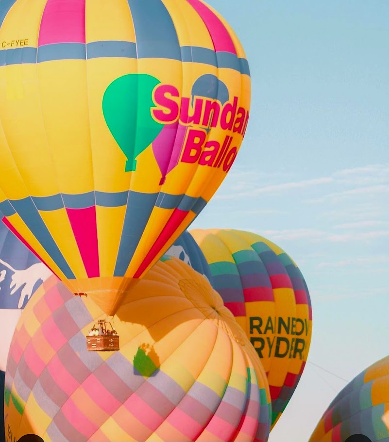 Close-up of colourful Sundance hot air balloon against a blue sky