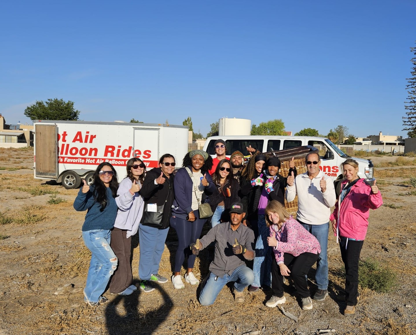 Hot air balloon floating above patchwork Ontario farmland